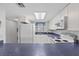 Open kitchen featuring white appliances and blue granite countertops at 2626 S Atlantic Ave # 1080, Daytona Beach, FL 32118