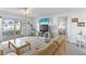 Bright living area features neutral tones, sliding glass doors to a patio, and comfortable seating at 2626 S Atlantic Ave # 1080, Daytona Beach, FL 32118