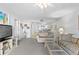 Open living area leading to kitchen with tile flooring and comfortable seating arrangement at 2626 S Atlantic Ave # 1080, Daytona Beach, FL 32118