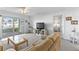 Bright living area features neutral tones, sliding glass doors to a patio, and comfortable seating at 2626 S Atlantic Ave # 1080, Daytona Beach, FL 32118