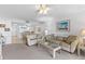 Bright living area leading into an open kitchen, featuring comfortable seating and natural light at 2626 S Atlantic Ave # 1080, Daytona Beach, FL 32118