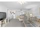 Open living area leading to kitchen with tile flooring and comfortable seating arrangement at 2626 S Atlantic Ave # 1080, Daytona Beach, FL 32118