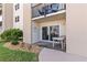 Private patio with outdoor seating and sliding glass doors provides pool access at 2626 S Atlantic Ave # 1080, Daytona Beach, FL 32118