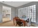 Bright dining room with tile flooring, a wood table with four chairs, and glass block window at 263 Seaview Ave, Daytona Beach, FL 32118