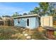 A blue exterior of a home with backyard shed and stepping stones at 263 Seaview Ave, Daytona Beach, FL 32118