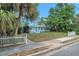 Light blue home with white picket fence, showcasing its curb appeal in a sunny setting at 263 Seaview Ave, Daytona Beach, FL 32118
