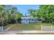 A light blue single-story home featuring a well-manicured lawn and mature trees at 263 Seaview Ave, Daytona Beach, FL 32118