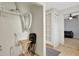 Functional laundry area with shelving and access to the living room. A table and chairs are shown at 263 Seaview Ave, Daytona Beach, FL 32118