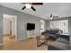 Comfortable living room featuring neutral colors, ceiling fans, tiled floors, and ample natural light at 263 Seaview Ave, Daytona Beach, FL 32118