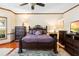 Comfortable bedroom with wood floors, ceiling fan, and ample natural light at 2635 Wood Duck Vlg, Deland, FL 32720