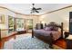 Bedroom with bay window, hardwood floors and decorative rug at 2635 Wood Duck Vlg, Deland, FL 32720