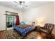 Inviting bedroom featuring a cozy area rug and access to outdoor space at 2635 Wood Duck Vlg, Deland, FL 32720