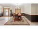 Formal dining room featuring a classic chandelier, a large wooden table with seating for six, and elegant decor at 2635 Wood Duck Vlg, Deland, FL 32720