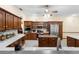 Well-equipped kitchen with island, stainless appliances, and wood cabinetry at 2635 Wood Duck Vlg, Deland, FL 32720