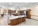 Updated kitchen offers stainless appliances, wood cabinetry, and island seating at 2635 Wood Duck Vlg, Deland, FL 32720