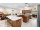 Open kitchen with island, breakfast bar seating and stainless steel appliances at 2635 Wood Duck Vlg, Deland, FL 32720