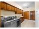 Well-equipped laundry room offers stainless washer/dryer and plenty of cabinet space at 2635 Wood Duck Vlg, Deland, FL 32720
