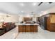 Spacious open concept living space with island seating and stainless appliances at 2635 Wood Duck Vlg, Deland, FL 32720