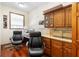 Bright home office with wood floors, built-in shelves, and large window at 2635 Wood Duck Vlg, Deland, FL 32720