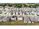 Aerial view of a two-story home nestled among similar properties in a quiet suburban neighborhood at 2743 Gentle Rain Dr, Davenport, FL 33837