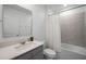 Well-lit bathroom featuring modern fixtures, a shower-tub combination, and a gray vanity at 2743 Gentle Rain Dr, Davenport, FL 33837