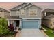 Charming two-story home showcasing a neatly manicured lawn, inviting exterior colors, and a two car garage at 2743 Gentle Rain Dr, Davenport, FL 33837