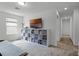 Bright loft area with TV, shelving and storage, and neutral-toned carpeting at 2743 Gentle Rain Dr, Davenport, FL 33837