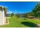 Expansive backyard with a pond, fountain, and lush greenery, perfect for outdoor enjoyment at 2901 Monaghan Dr, Ormond Beach, FL 32174