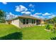 Spacious backyard with well-maintained lawn and partial view of the property's exterior at 2901 Monaghan Dr, Ormond Beach, FL 32174
