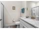 Bathroom with granite counters, framed mirror, shower with glass doors, and attractive fixtures at 2901 Monaghan Dr, Ormond Beach, FL 32174