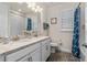 Bathroom with double sinks, granite counters, a large mirror, and a shower/tub combination at 2901 Monaghan Dr, Ormond Beach, FL 32174