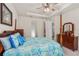 Spacious primary bedroom with four-poster bed and beautiful ensuite bathroom access at 2901 Monaghan Dr, Ormond Beach, FL 32174