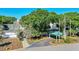 A charming clubhouse featuring a covered entrance and picturesque landscaping at 2901 Monaghan Dr, Ormond Beach, FL 32174