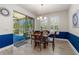 Bright dining room with sliding glass doors leading to the outdoor patio and a lovely pond view at 2901 Monaghan Dr, Ormond Beach, FL 32174