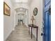 Foyer with tile flooring, arched doorways, and an entry table at 2901 Monaghan Dr, Ormond Beach, FL 32174