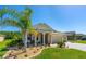 Inviting front exterior with landscaped yard and a charming front porch at 2901 Monaghan Dr, Ormond Beach, FL 32174