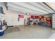 Spacious garage with epoxy flooring, storage, and room for vehicles and projects at 2901 Monaghan Dr, Ormond Beach, FL 32174