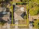 Aerial view of single-story home with fenced-in backyard including small storage building in quiet neighborhood at 3109 Sky St, Deltona, FL 32738