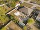 Aerial view of the backyard featuring a patio area, small building and an open area in the yard at 3109 Sky St, Deltona, FL 32738
