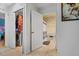 A well-lit bathroom featuring a neutral color scheme and a partial view of the laundry area at 3109 Sky St, Deltona, FL 32738