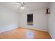 A minimalist bedroom featuring hardwood floors, a ceiling fan, and a bright window at 3109 Sky St, Deltona, FL 32738