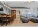 Cozy dining area featuring a wooden table, tile floors, and open archway to the living room at 3109 Sky St, Deltona, FL 32738