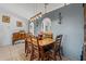 Inviting dining room featuring a wooden table, tile floors, stylish lighting and neutral wall color at 3109 Sky St, Deltona, FL 32738