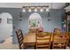 Charming dining room featuring a wooden table with seating, tile floors, and modern light fixture at 3109 Sky St, Deltona, FL 32738
