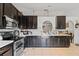 Kitchen area with a sink, dark cabinetry and white countertops at 3109 Sky St, Deltona, FL 32738