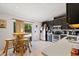 Well-lit kitchen with tile floors, stainless appliances, and a casual dining area with seating at 3109 Sky St, Deltona, FL 32738