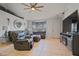 Inviting living room with tile floors, large windows, comfortable seating and stylish furnishings at 3109 Sky St, Deltona, FL 32738