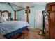 Bedroom with an ornate four-poster bed and view of doors at 3109 Sky St, Deltona, FL 32738