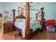 Bedroom featuring a four-poster bed and wood floors at 3109 Sky St, Deltona, FL 32738