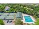 Aerial view showcasing a pool, tennis courts, and green spaces, creating a resort-like feel at 3140 Kailani Ct, Ormond Beach, FL 32174